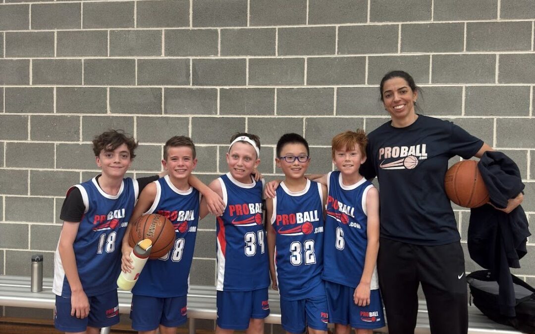 Basketball players competing in trial showcasing effort and defense.